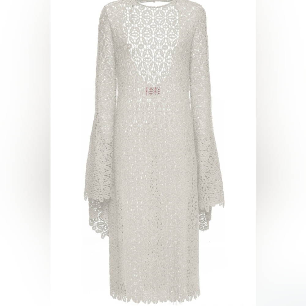 Solid white in cotton lacy Costiera dress.